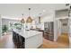 Bright, open kitchen with large island, modern stainless steel appliances, and stylish lighting at 1467 Battalion Dr, James Island, SC 29412