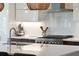Well-equipped kitchen with stainless steel appliances, modern white cabinetry, and complementary brown accents at 1467 Battalion Dr, James Island, SC 29412