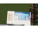 Aerial view of a backyard pool with sun loungers on a tiled patio at 1467 Battalion Dr, James Island, SC 29412