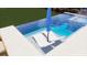 An inviting backyard pool with lounge chairs and a sun umbrella for relaxation at 1467 Battalion Dr, James Island, SC 29412