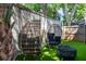 Private backyard featuring modern seating arrangements and manicured synthetic grass at 15 H Street St, Charleston, SC 29403