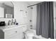 Bathroom featuring vanity with sink, toilet, tub/shower combo with gray curtain at 15 H Street St, Charleston, SC 29403