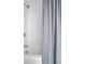 Modern bathroom features white subway tile, brushed nickel hardware and a stylish shower curtain at 15 H Street St, Charleston, SC 29403