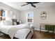 Inviting bedroom with hardwood floors, a ceiling fan, and natural light from the double windows at 15 H Street St, Charleston, SC 29403