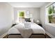 Comfortable bedroom featuring a plush bed, soft lighting, and views to the home exterior at 15 H Street St, Charleston, SC 29403