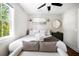 Serene bedroom with neutral tones, decorative lighting, and a luxurious bed with plush bedding at 15 H Street St, Charleston, SC 29403