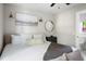 Bright bedroom featuring stylish lighting, comfortable king bed, and ensuite bathroom access at 15 H Street St, Charleston, SC 29403