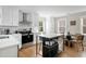 Modern kitchen with a center island, stainless steel appliances, and adjacent dining area for casual meals at 15 H Street St, Charleston, SC 29403