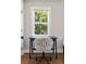 Small writing desk with armless accent chair in a room filled with light at 15 H Street St, Charleston, SC 29403