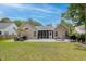 Spacious backyard with patio, screened porch, grill, and picnic table, perfect for outdoor activities at 1525 Cypress Pointe Dr, Mount Pleasant, SC 29466