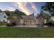 Beautiful backyard featuring a patio with outdoor seating, grill and a well-maintained lawn at 1525 Cypress Pointe Dr, Mount Pleasant, SC 29466