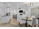 Cozy dining area adjacent to a kitchen and living room with recessed lights at 1525 Cypress Pointe Dr, Mount Pleasant, SC 29466