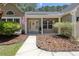 Charming home featuring a well manicured lawn, flowering plants, and a welcoming front porch at 1525 Cypress Pointe Dr, Mount Pleasant, SC 29466