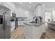 Modern kitchen featuring stainless steel appliances, granite countertops, and white cabinets at 1525 Cypress Pointe Dr, Mount Pleasant, SC 29466