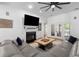 Bright living room featuring a fireplace, large sectional sofa, and recessed lighting at 1525 Cypress Pointe Dr, Mount Pleasant, SC 29466