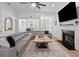 Bright living room featuring a fireplace, large sectional sofa, view into the Dining area at 1525 Cypress Pointe Dr, Mount Pleasant, SC 29466