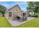 A beautifully designed back patio with seating and an umbrella, perfect for outdoor relaxation at 1525 Cypress Pointe Dr, Mount Pleasant, SC 29466