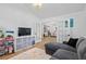 Spacious playroom with grey sectional and adjacent dining space, perfect for Gathering time at 1525 Cypress Pointe Dr, Mount Pleasant, SC 29466