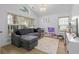 A cozy playroom featuring a large sectional sofa, play kitchen, and bright natural light at 1525 Cypress Pointe Dr, Mount Pleasant, SC 29466