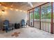Comfortable screened porch with tiled floors and chairs at 1525 Cypress Pointe Dr, Mount Pleasant, SC 29466