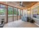 Inviting screened porch with ceiling fan, tiled flooring, and views of the backyard at 1525 Cypress Pointe Dr, Mount Pleasant, SC 29466