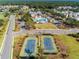 Aerial view of a new neighborhood featuring tennis courts, a pool, and playground at 1569 Red Tide Rd, Mount Pleasant, SC 29466