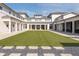 Enjoy this green lawn courtyard with artificial turf between symmetrical modern buildings at 1569 Red Tide Rd, Mount Pleasant, SC 29466