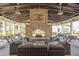 Relax by the grand fireplace with seating and picnic tables under the covered patio at 1569 Red Tide Rd, Mount Pleasant, SC 29466