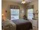Well-lit bedroom featuring a comfortable bed, neutral walls, and window with valances at 1600 Long Grove Dr # 411, Mount Pleasant, SC 29464