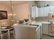 Cozy kitchen with an adjacent dining area, ample storage, and an open layout for easy entertaining at 1600 Long Grove Dr # 411, Mount Pleasant, SC 29464