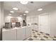 Bright laundry room with multiple washers and dryers, ample lighting, and a checkerboard floor at 1600 Long Grove Dr # 411, Mount Pleasant, SC 29464