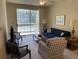 Comfortable living room with large sliding doors for natural light, and stylish furniture at 1600 Long Grove Dr # 411, Mount Pleasant, SC 29464