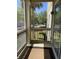 Cozy screened porch with a view of the surrounding landscape and community at 1600 Long Grove Dr # 411, Mount Pleasant, SC 29464