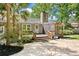 Charming backyard with a wooden deck, a screened porch, and a brick patio at 1673 Sulgrave Rd, Charleston, SC 29414