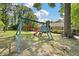 A swing set sits in the backyard of this property with mature trees and an enclosed hot tub at 1673 Sulgrave Rd, Charleston, SC 29414