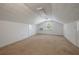Spacious bonus room features carpet, natural light, and ample storage at 1673 Sulgrave Rd, Charleston, SC 29414