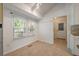 Bright dining area featuring tile flooring, large windows, and convenient access to the kitchen and outdoors at 1673 Sulgrave Rd, Charleston, SC 29414