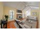 Beautifully decorated living room with vaulted ceilings, hardwood floors, brick fireplace and stylish modern furniture at 1673 Sulgrave Rd, Charleston, SC 29414