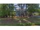 Large backyard with a patio, fire pit, and lots of green space, creating an ideal setting for outdoor living at 1709 Blalock St, Mount Pleasant, SC 29466