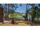 Charming backyard with palm trees, lake view, and plenty of shade at 1709 Blalock St, Mount Pleasant, SC 29466