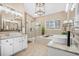 Bright bathroom boasts dual sinks, soaking tub, and walk-in shower at 1709 Blalock St, Mount Pleasant, SC 29466