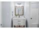 This bathroom features a bright white vanity with modern finishes and a tiled shower at 1709 Blalock St, Mount Pleasant, SC 29466
