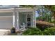Inviting covered front porch with rocking chairs and well-maintained landscaping at 1709 Blalock St, Mount Pleasant, SC 29466