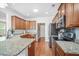 Kitchen features granite countertops, stainless steel appliances, and hardwood floors, creating a warm and inviting space at 1709 Blalock St, Mount Pleasant, SC 29466