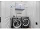 Convenient laundry room with front loading washer and dryer, storage, and plenty of room for sorting at 1709 Blalock St, Mount Pleasant, SC 29466