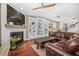 Open concept living area with fireplace, built-in shelving, and modern furnishings at 1709 Blalock St, Mount Pleasant, SC 29466