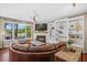 Bright living room with fireplace, custom shelving, and comfortable seating area at 1709 Blalock St, Mount Pleasant, SC 29466