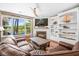 Bright living area with fireplace, lake views, and comfortable leather seating at 1709 Blalock St, Mount Pleasant, SC 29466