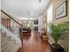 Open concept living area with hardwood floors, fireplace, and staircase at 1709 Blalock St, Mount Pleasant, SC 29466