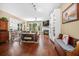 Spacious living room featuring hardwood floors, fireplace, and dining area at 1709 Blalock St, Mount Pleasant, SC 29466